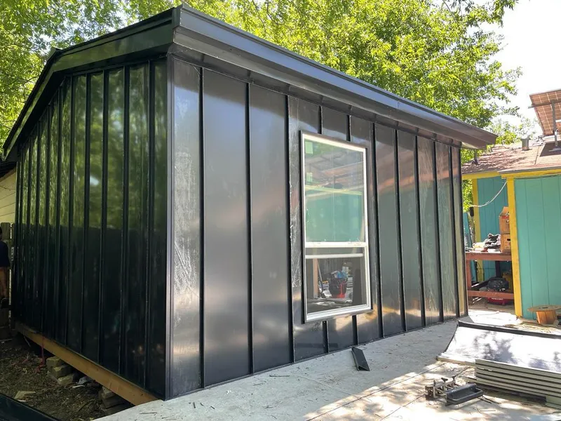 Black standing seam metal wall panels for Metal Roof Installation in Clive