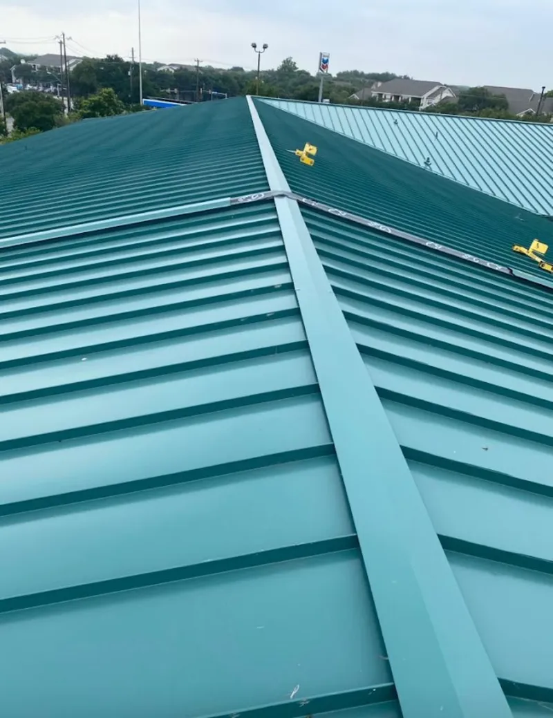 Green commercial metal roof ridge and valley for Metal Roof Repair in Clive